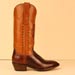 handmade customized cowboy boot of cognac milano buffalo with horseshoe inlay and buckstitching