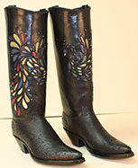 custom black ostrich cowboy boot with inlayed peacock accented with crystal stones on a regal cut top