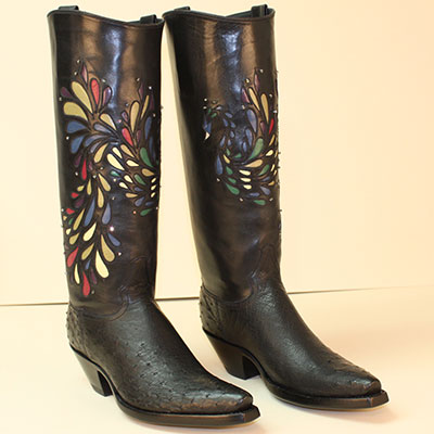 black ostrich custom cowboy boot with inlayed peacock design accented with crystal stones on a regal cut top