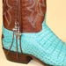 custom made turquoise caiman cowboy boot with cognac shadow goat handstitching and silver cross