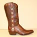 handmade cowboy boot of vintage cognac alligator with Texas Star conchos
