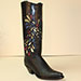 handcrafted black ostrich cowboy boot with inlayed peacock design accented with crystal stones on a black regal shaft